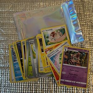 Collection of 30 Pokémon trading cards. Includes various cards/vibrant designs.
